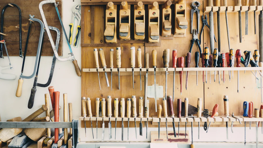 A workshop wall of hand tools, each hanging in its place